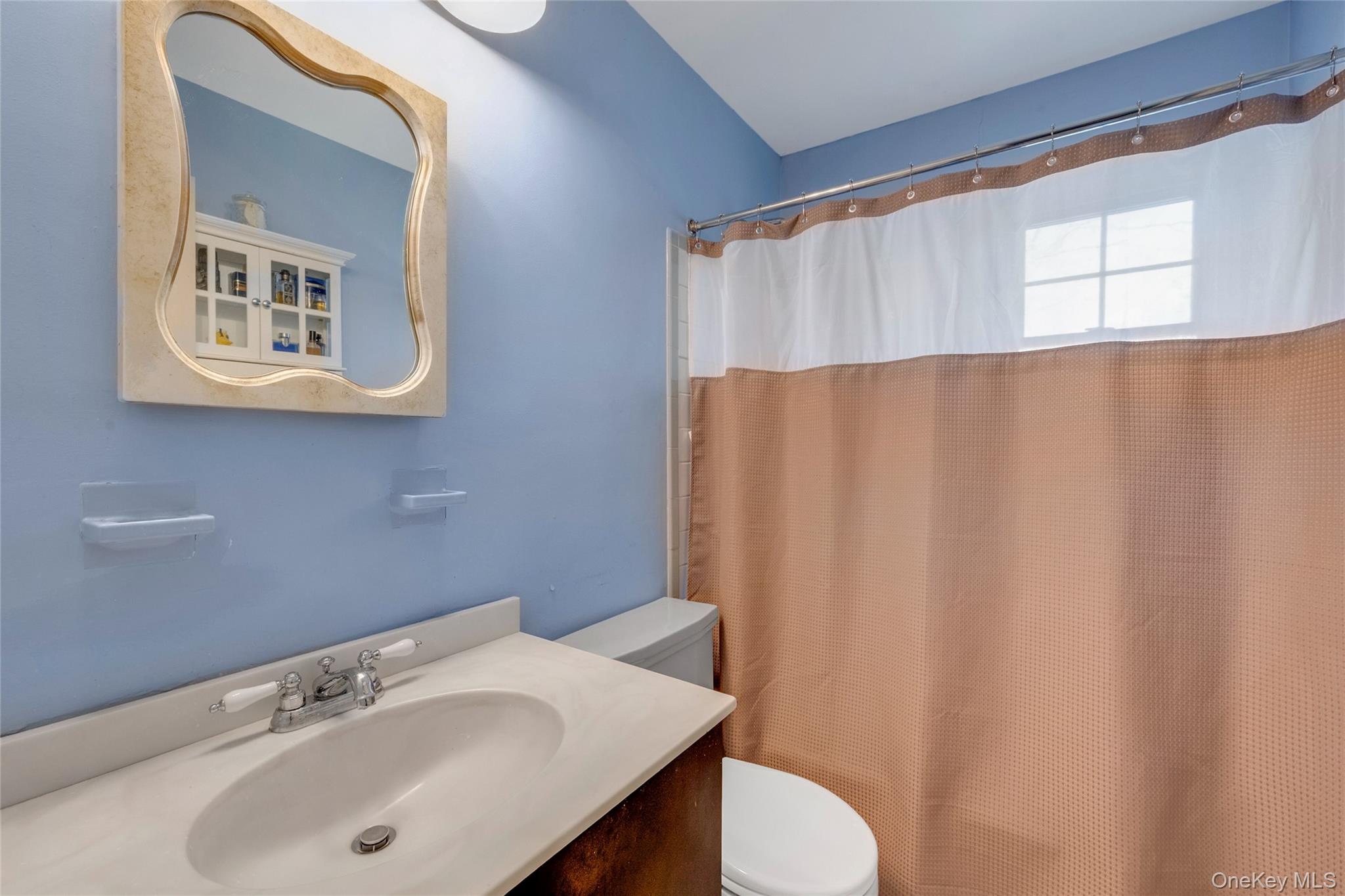 119 Goldens Bridge Road Katonah, NY 10536 - Photo 32 of 34 a bathroom with a sink and a mirror