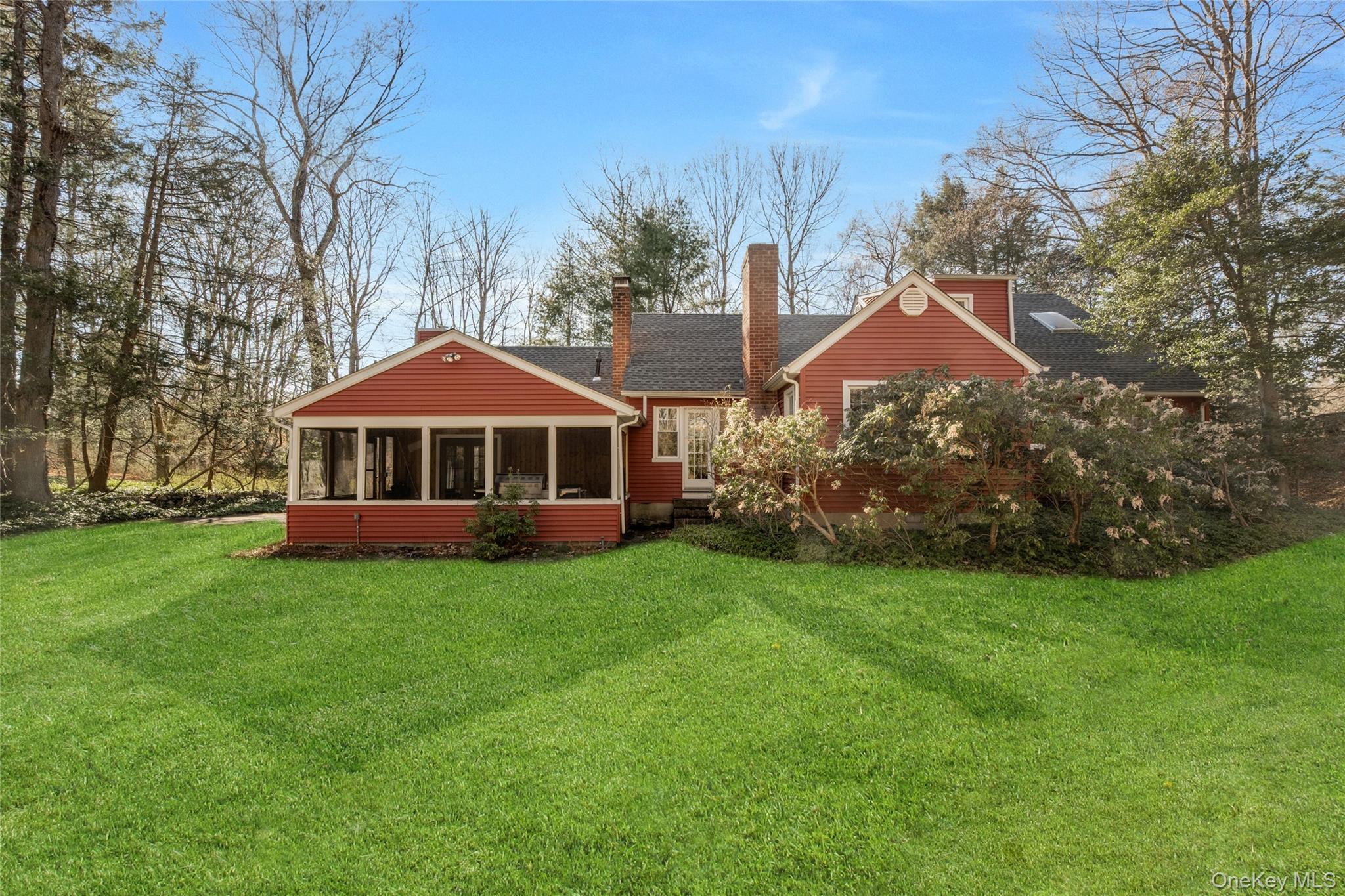 119 Goldens Bridge Road Katonah, NY 10536 - Photo 34 of 34 a front view of a house with a garden
