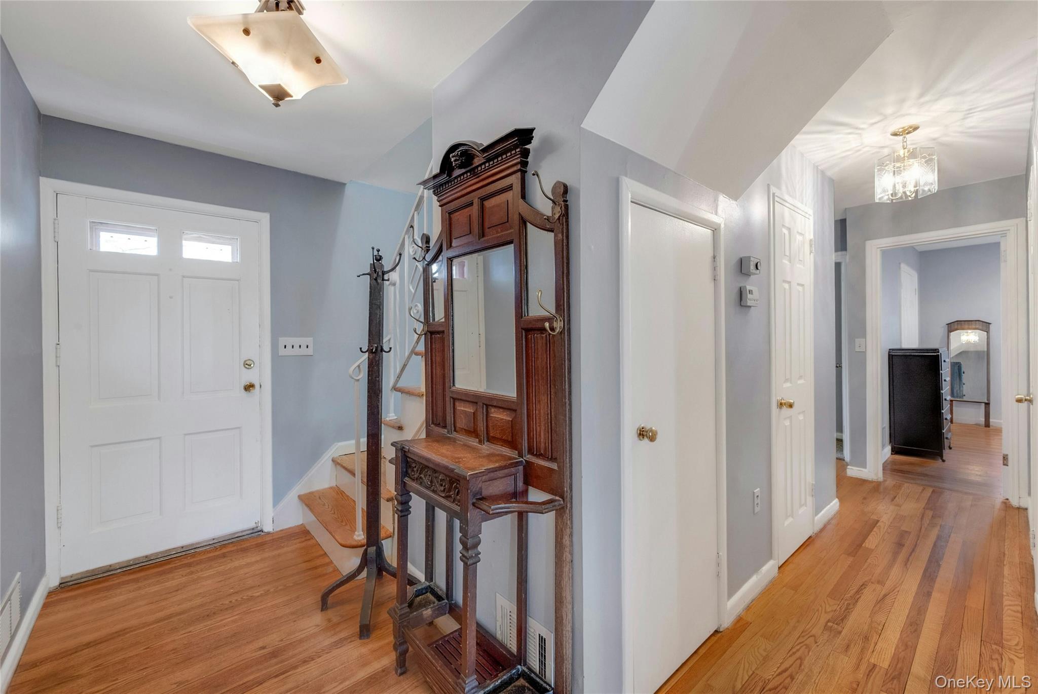 119 Goldens Bridge Road Katonah, NY 10536 - Photo 4 of 34 a view of a hallway with wooden floor and staircase