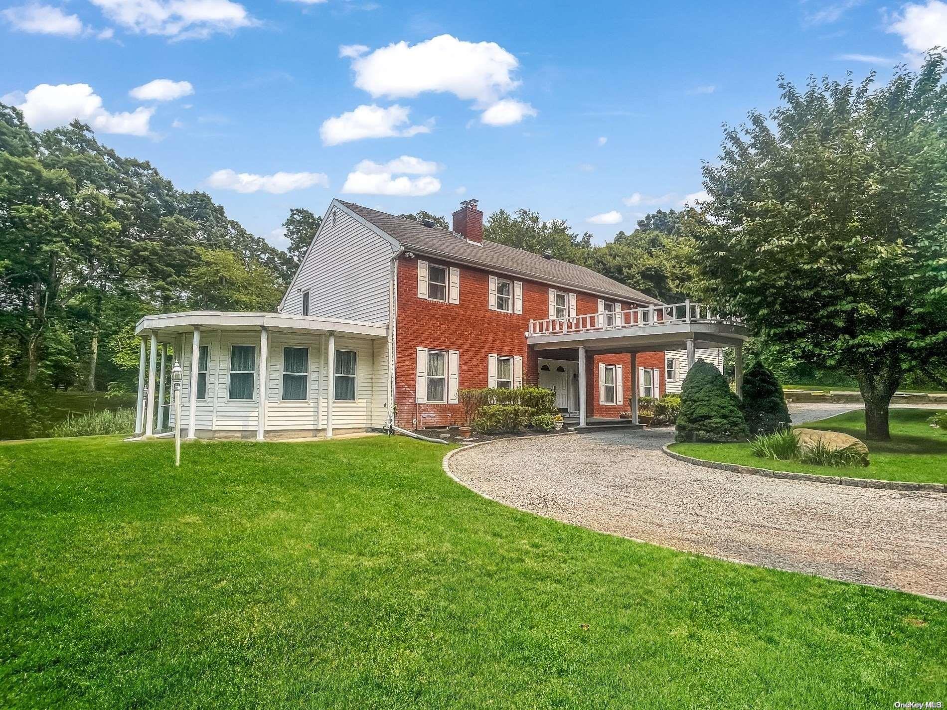 323 Old Mill Road Nissequogue, NY 11780 - Photo 1 of 1 a front view of a house with a yard