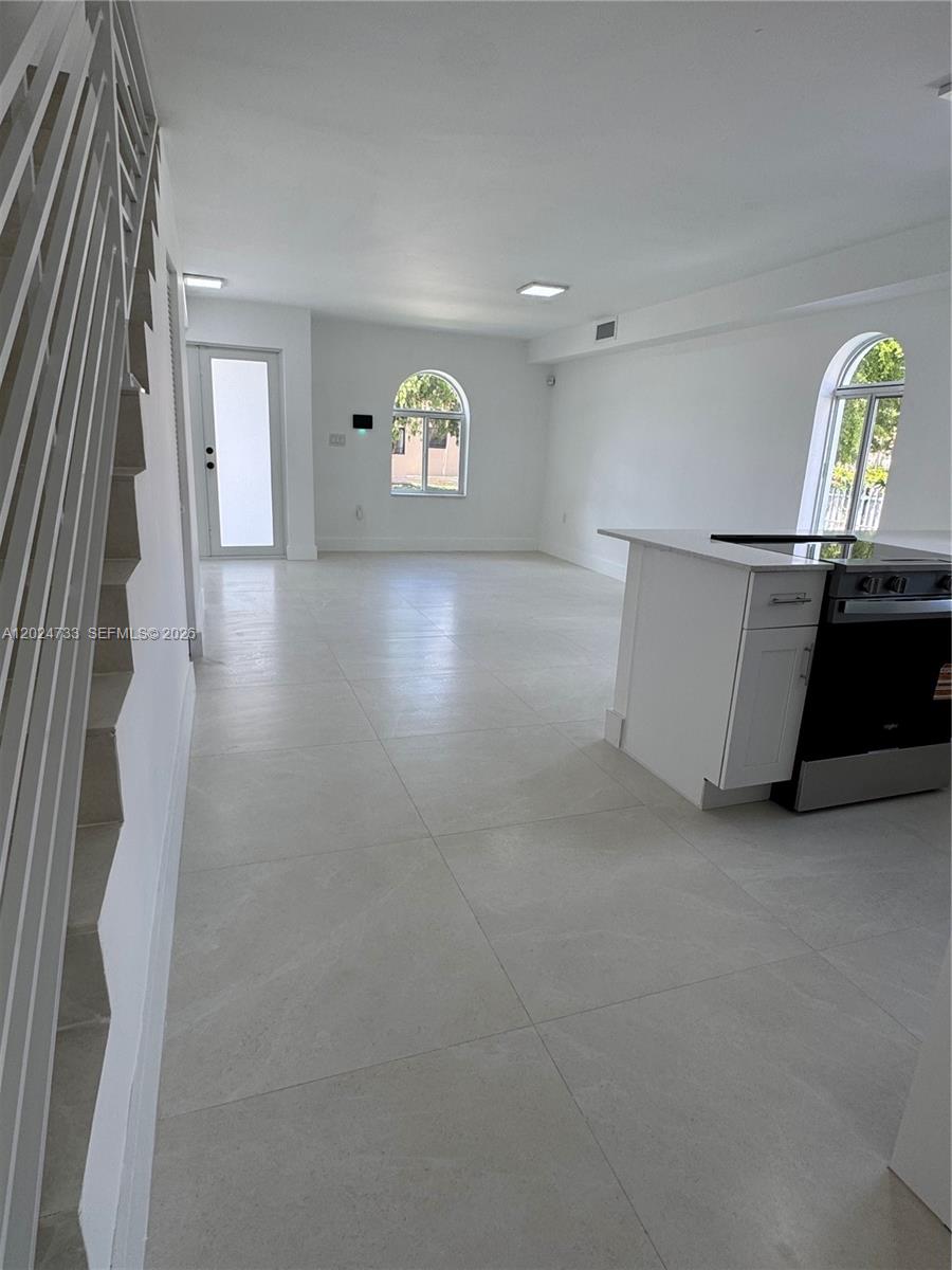 3305 Southwest 28th Street, Unit 3305 Miami, FL 33133 - Photo 4 of 17 en view interior of a house with wooden floor