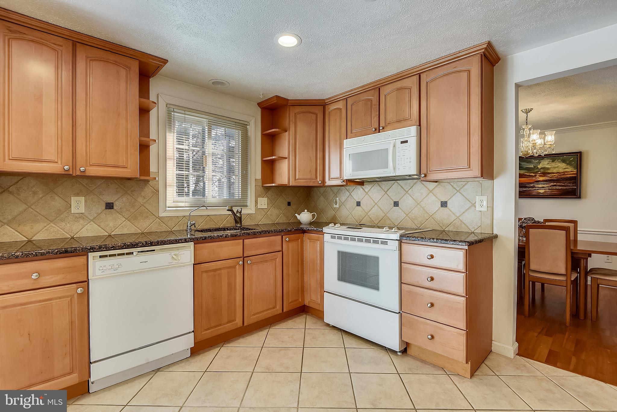 9401 Huntmaster Road Laytonsville, MD 20882 - Photo 13 of 56 Updated kitchen has cherry cabinets & granite