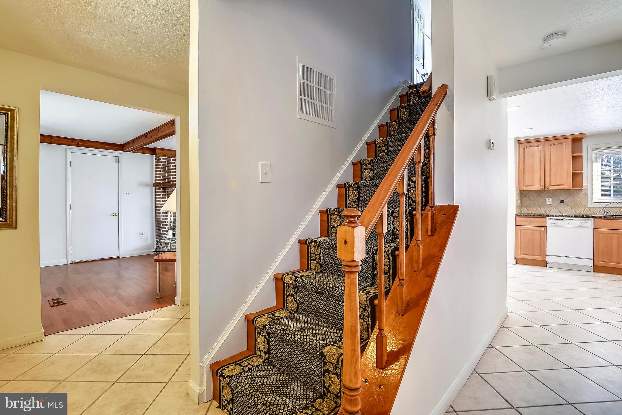 9401 Huntmaster Road Laytonsville, MD 20882 - Photo 7 of 56 Oak stairs with carpet runner to the bedroom level
