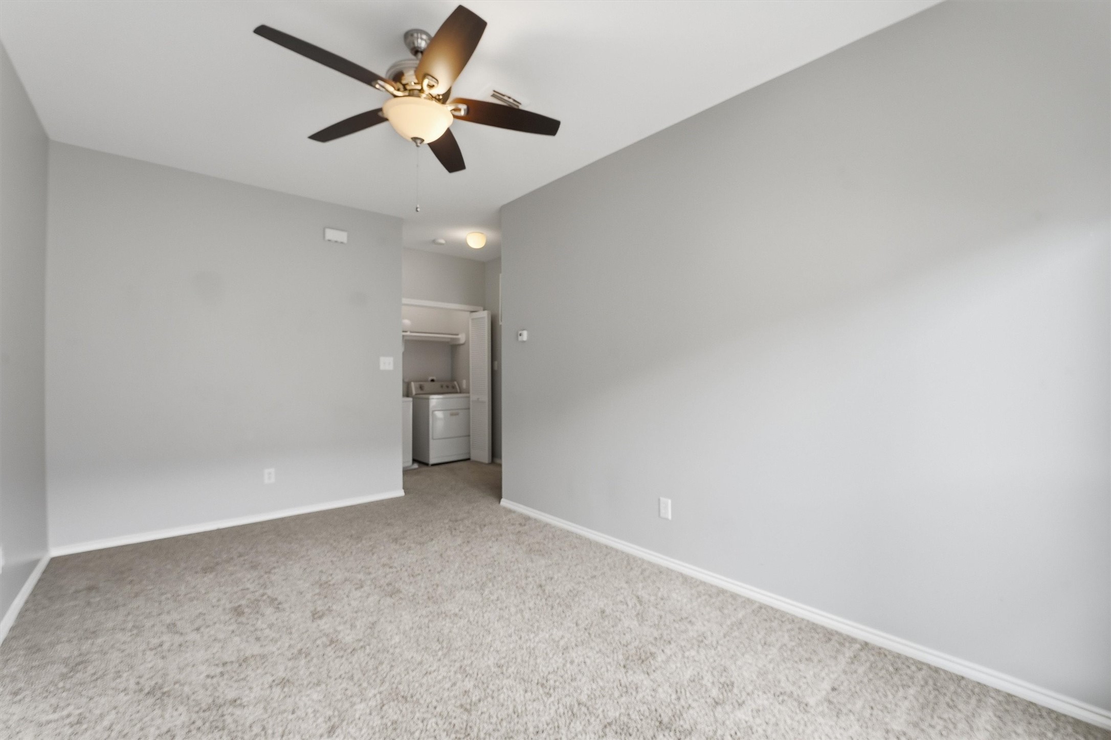 1507 Sutton Street Houston, TX 77006 - Photo 17 of 31 an empty room with a ceiling fan and a fan