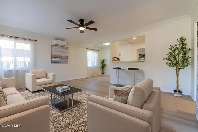 a living room with furniture and a table