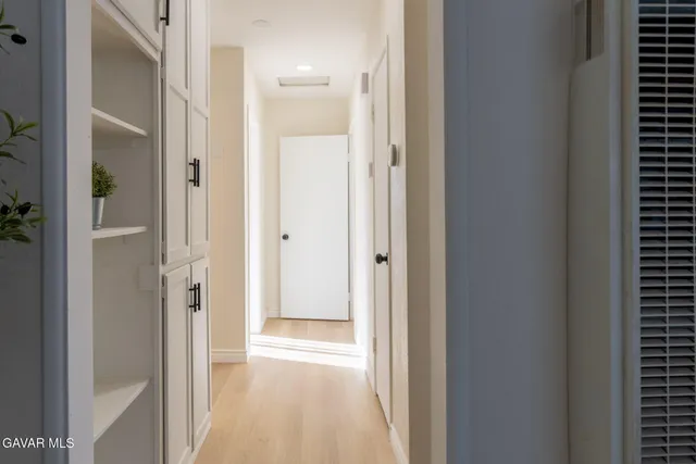 a view of a bathroom from a hallway