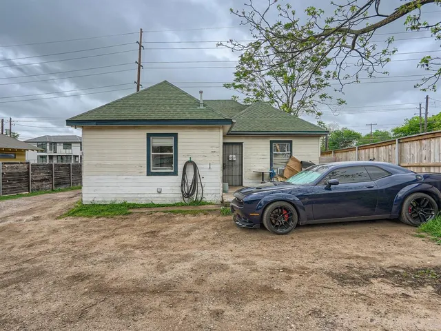 a car parked in front of a house