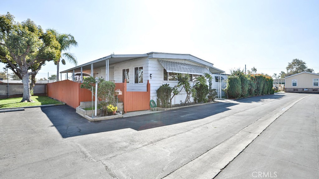 14300 Clinton Street, Unit 64 Garden Grove, CA 92843 - Photo 1 of 48 a view of a house with a yard