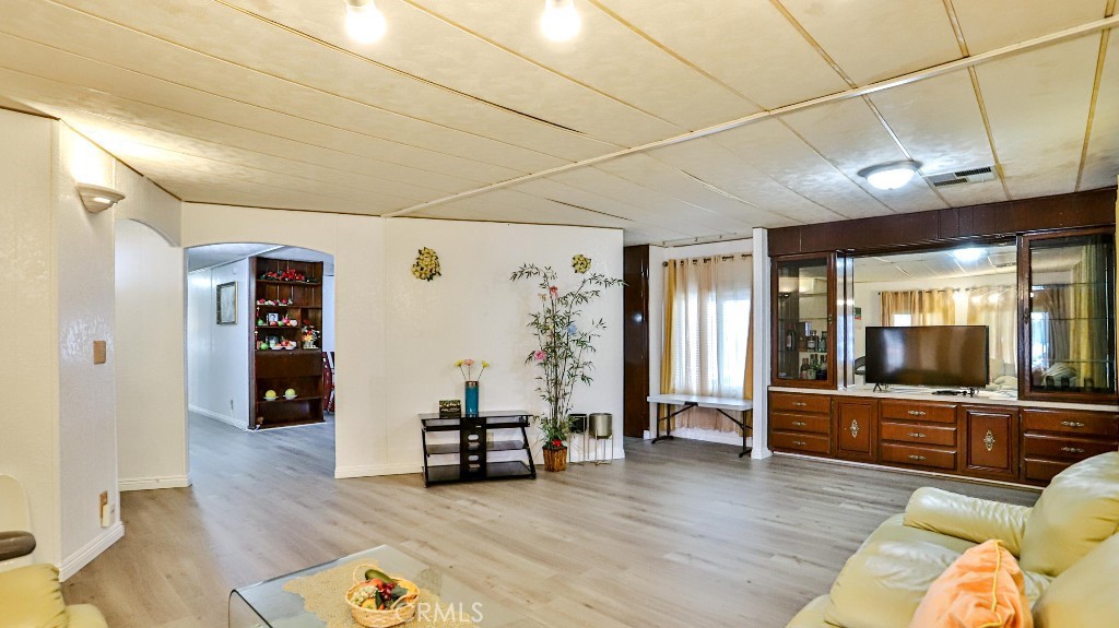 14300 Clinton Street, Unit 64 Garden Grove, CA 92843 - Photo 12 of 48 a living room with furniture and wooden floor