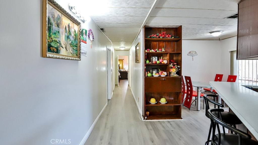 14300 Clinton Street, Unit 64 Garden Grove, CA 92843 - Photo 15 of 48 a dining room with furniture and wooden floor