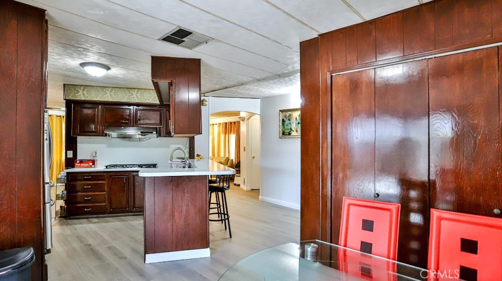 14300 Clinton Street, Unit 64 Garden Grove, CA 92843 - Photo 20 of 48 a kitchen with stainless steel appliances granite countertop a sink and a refrigerator