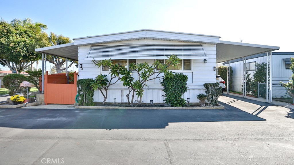 14300 Clinton Street, Unit 64 Garden Grove, CA 92843 - Photo 2 of 48 front view of house with potted plants