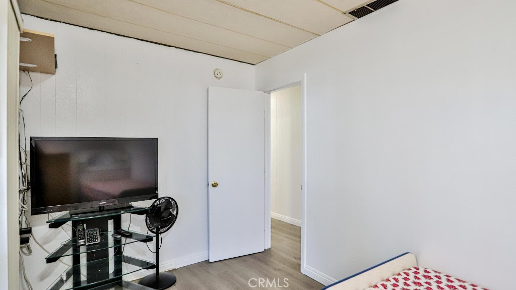 14300 Clinton Street, Unit 64 Garden Grove, CA 92843 - Photo 27 of 48 a living room with furniture and a flat screen tv