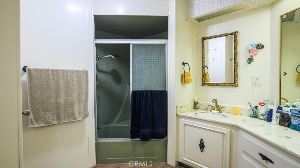 14300 Clinton Street, Unit 64 Garden Grove, CA 92843 - Photo 35 of 48 a bathroom with a sink and a mirror