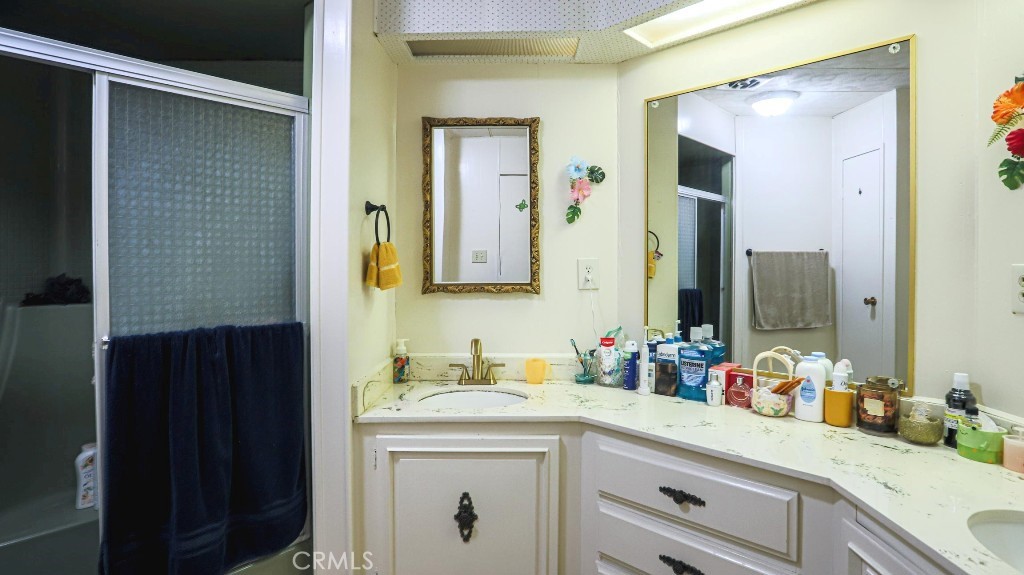 14300 Clinton Street, Unit 64 Garden Grove, CA 92843 - Photo 36 of 48 a bathroom with a sink and a mirror