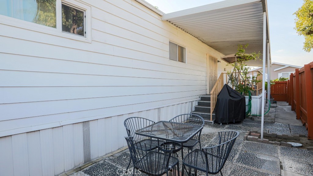 14300 Clinton Street, Unit 64 Garden Grove, CA 92843 - Photo 45 of 48 a view of a chairs and table in patio