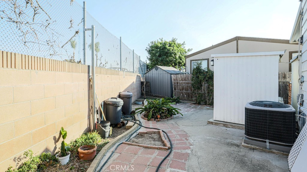 14300 Clinton Street, Unit 64 Garden Grove, CA 92843 - Photo 47 of 48 a front view of a house with garden