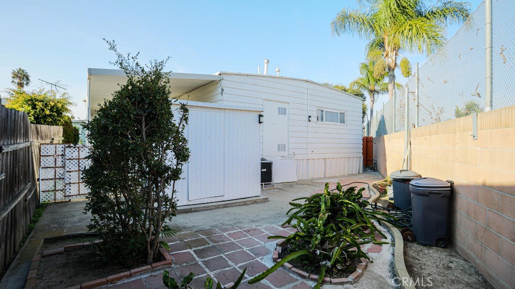 14300 Clinton Street, Unit 64 Garden Grove, CA 92843 - Photo 48 of 48 a plant is in front of a house