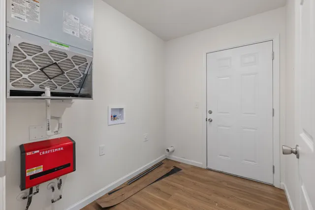 a bathroom with a granite countertop toilet a sink and a mirror