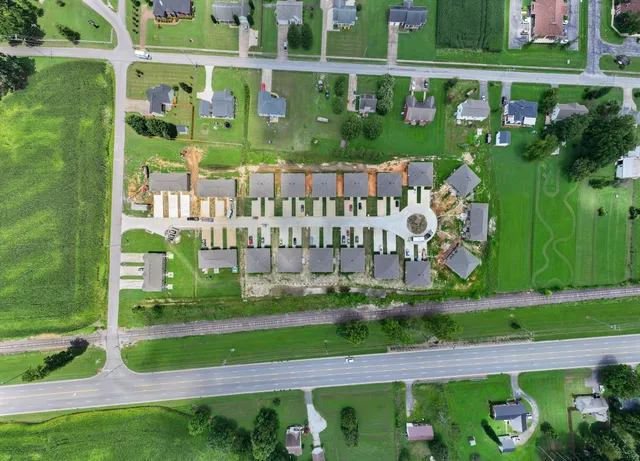 a view of a two chairs in patio with a yard