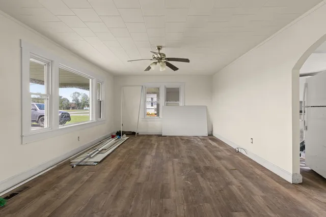 a view of storage and utility room with wooden floor