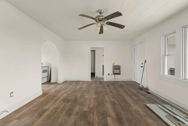 a utility room with granite countertop cabinets washer and dryer