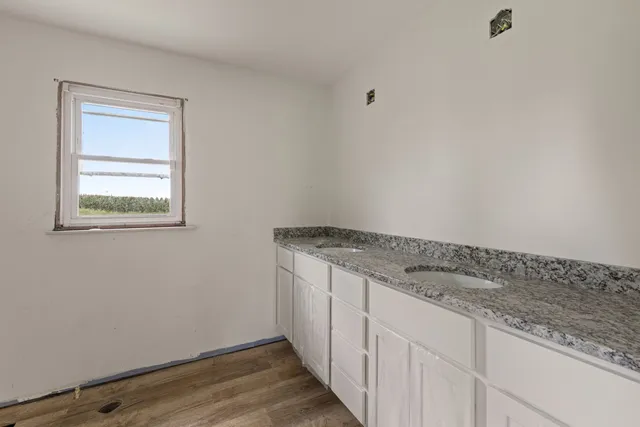 a kitchen with a stove a sink and a refrigerator