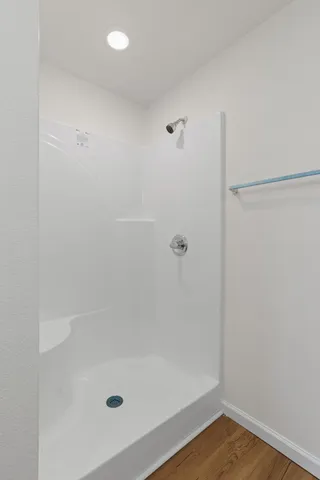 a view of a kitchen with a sink and wooden floor