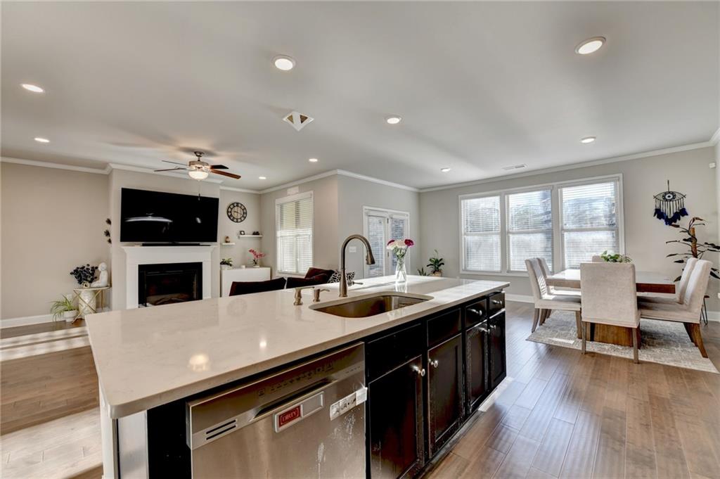2230 Manor Pointe Drive Cumming, GA 30041 - Photo 13 of 53 a kitchen with a sink a counter top space stainless steel appliances and a window