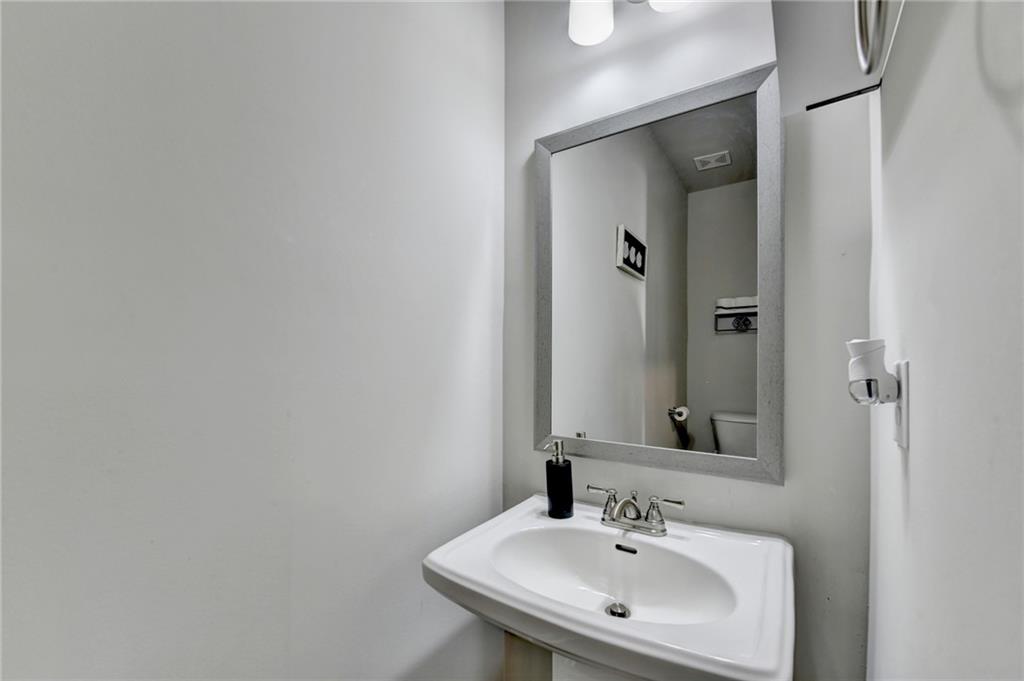2230 Manor Pointe Drive Cumming, GA 30041 - Photo 18 of 53 a bathroom with a sink and a mirror