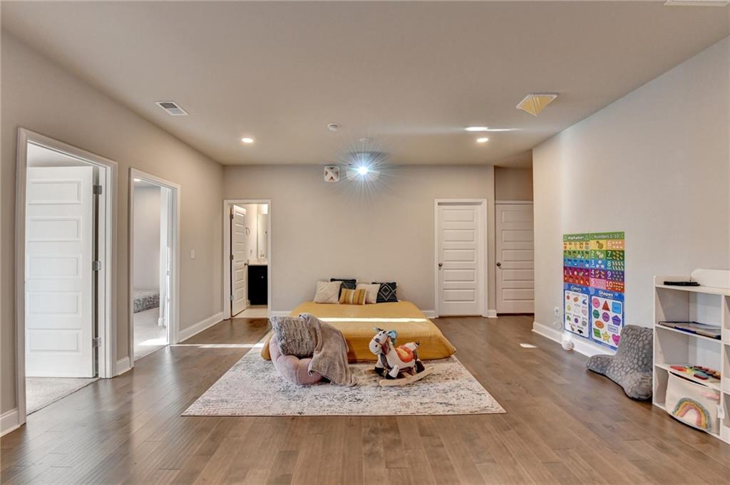 2230 Manor Pointe Drive Cumming, GA 30041 - Photo 21 of 53 a room with furniture and a book shelf