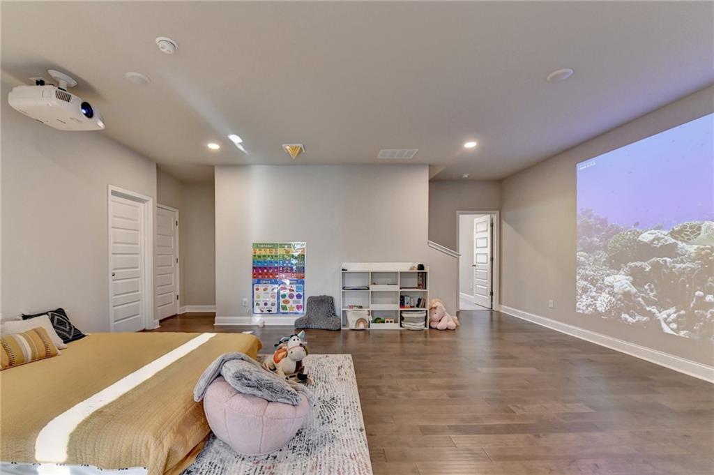 2230 Manor Pointe Drive Cumming, GA 30041 - Photo 23 of 53 a living room with furniture and a large window