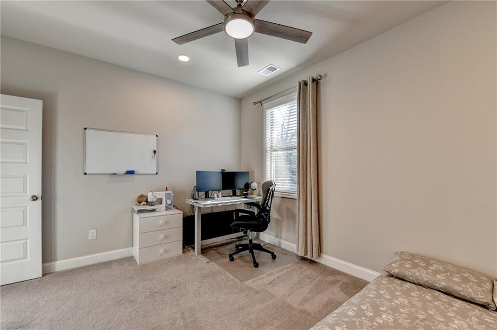 2230 Manor Pointe Drive Cumming, GA 30041 - Photo 25 of 53 a view of a workspace with furniture and a window