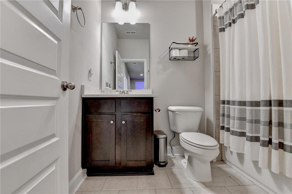 2230 Manor Pointe Drive Cumming, GA 30041 - Photo 26 of 53 a bathroom with a toilet sink and shower