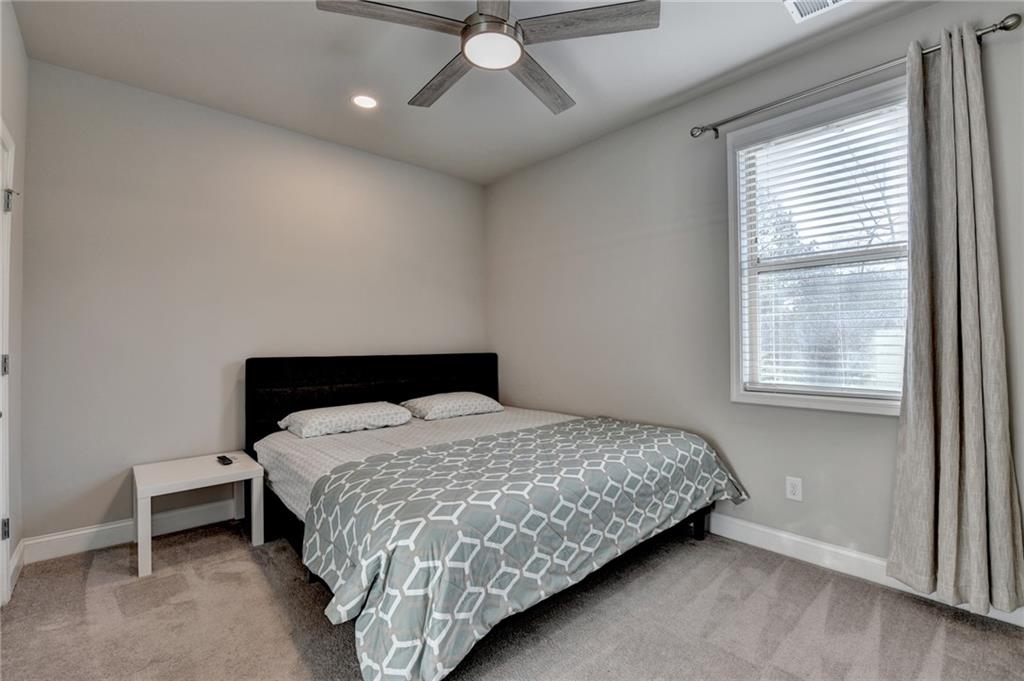 2230 Manor Pointe Drive Cumming, GA 30041 - Photo 27 of 53 a bedroom with a bed and a window
