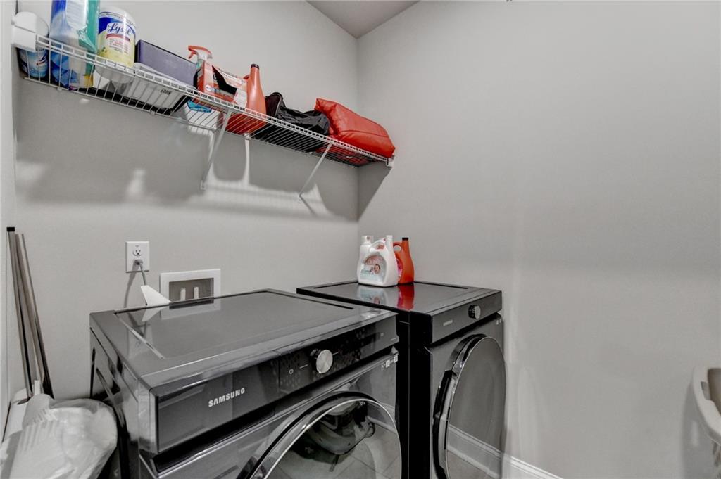 2230 Manor Pointe Drive Cumming, GA 30041 - Photo 31 of 53 a utility room with dryer and washer