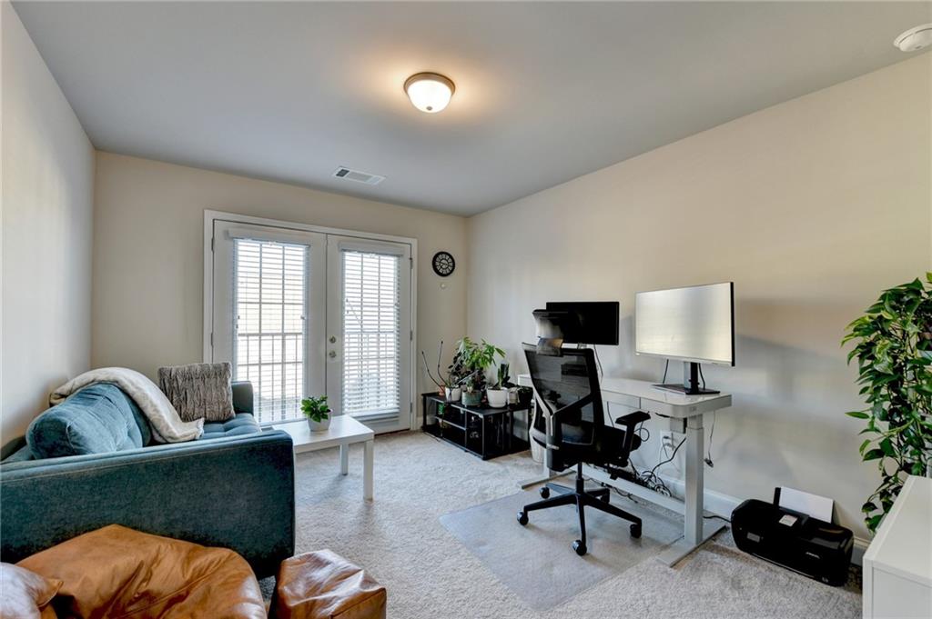 2230 Manor Pointe Drive Cumming, GA 30041 - Photo 37 of 53 a living room with furniture and a window