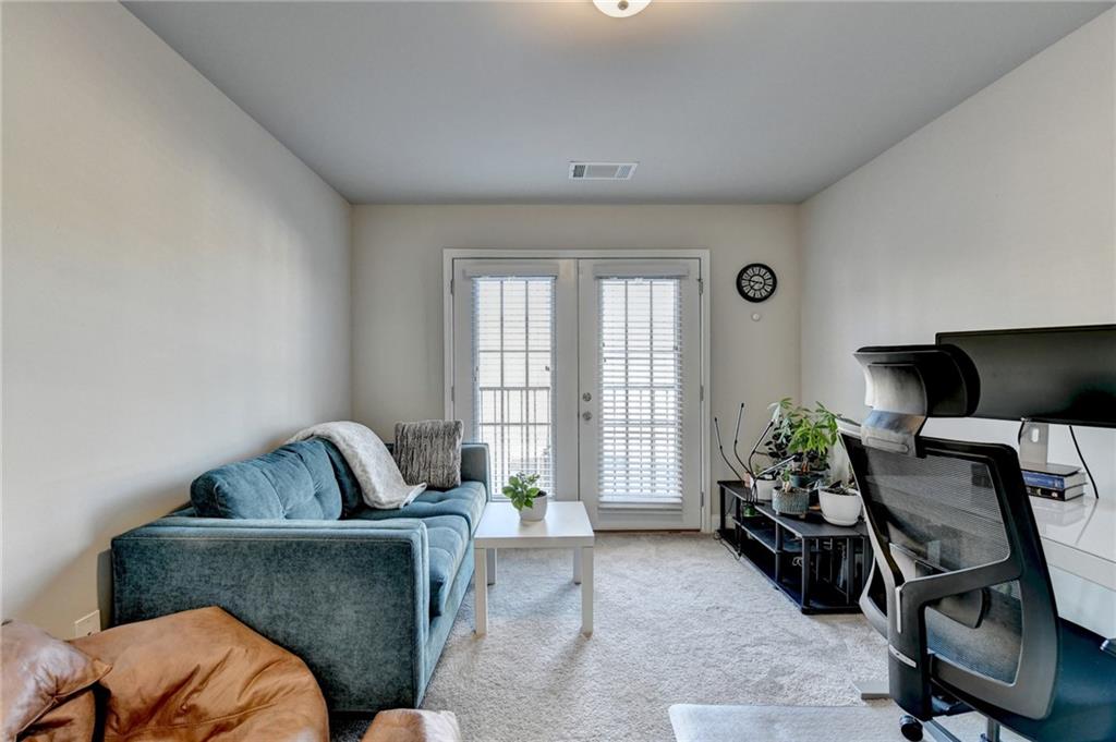 2230 Manor Pointe Drive Cumming, GA 30041 - Photo 38 of 53 a living room with furniture and a window