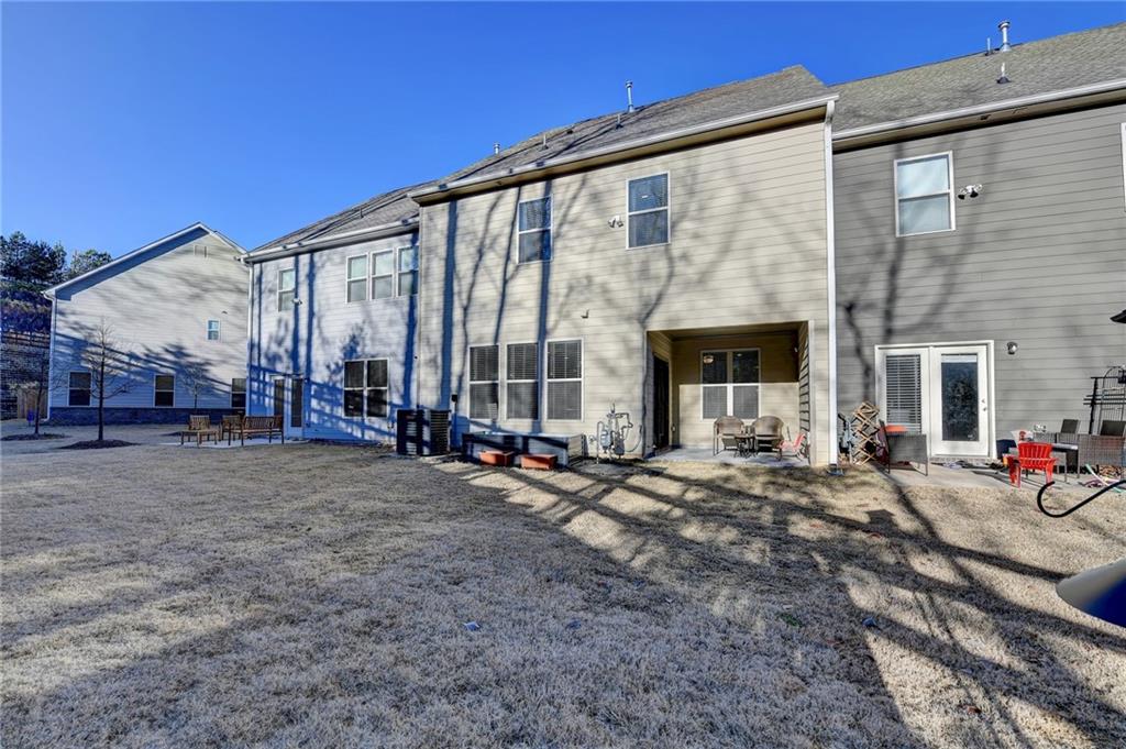 2230 Manor Pointe Drive Cumming, GA 30041 - Photo 41 of 53 a view of a house with backyard and porch