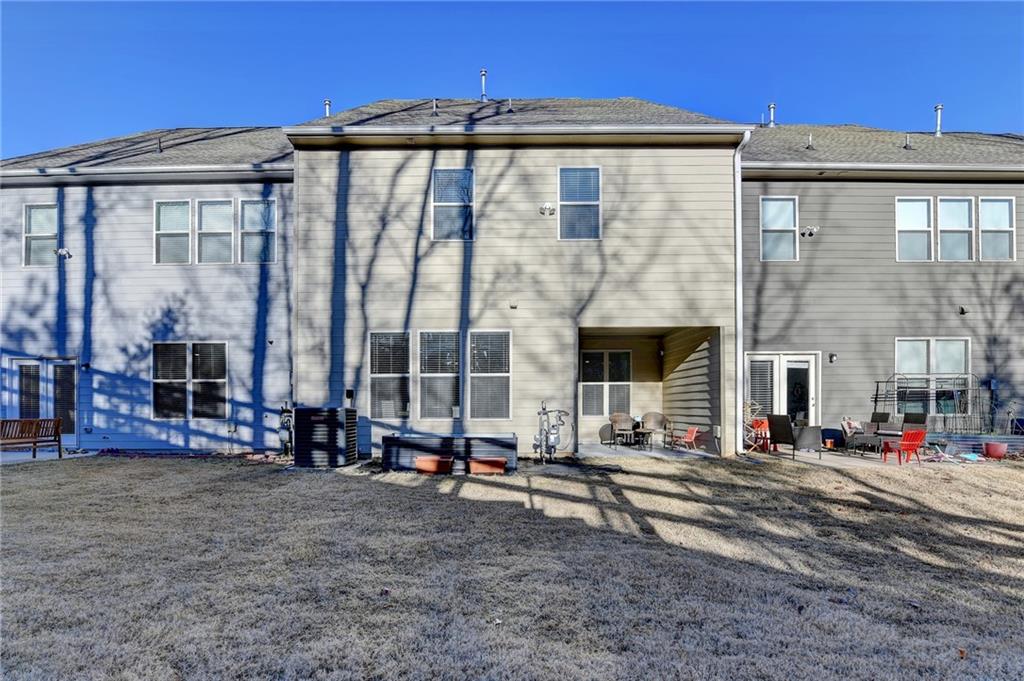 2230 Manor Pointe Drive Cumming, GA 30041 - Photo 42 of 53 a view of a building with many windows