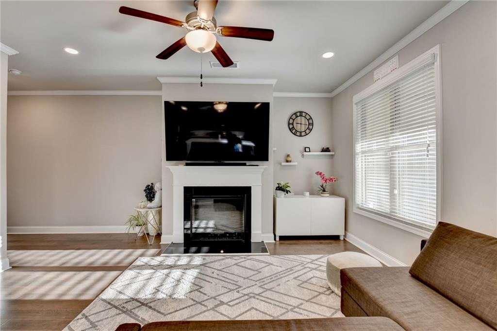 2230 Manor Pointe Drive Cumming, GA 30041 - Photo 5 of 53 a living room with furniture and a fireplace