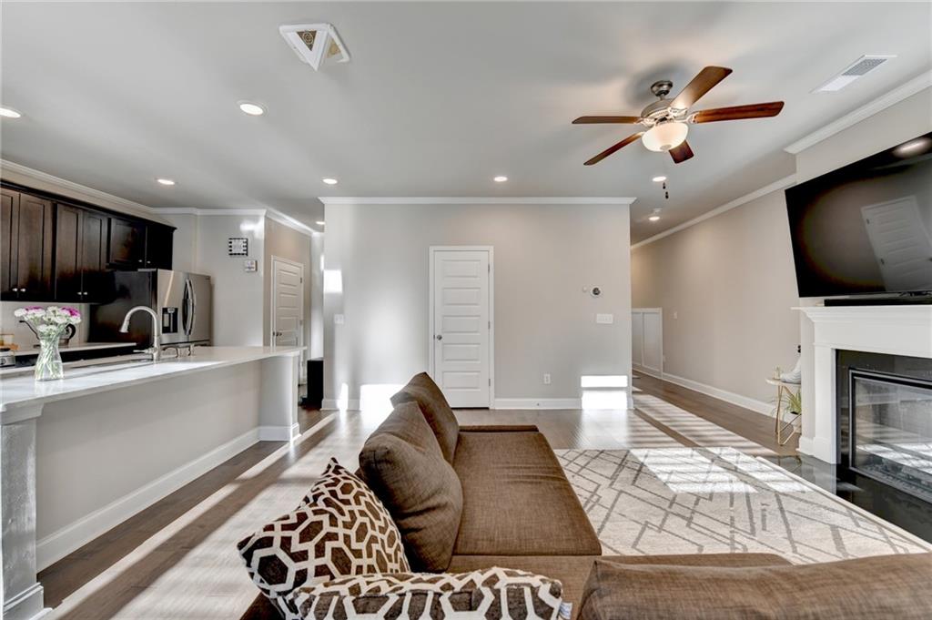 2230 Manor Pointe Drive Cumming, GA 30041 - Photo 7 of 53 a living room with furniture and a flat screen tv