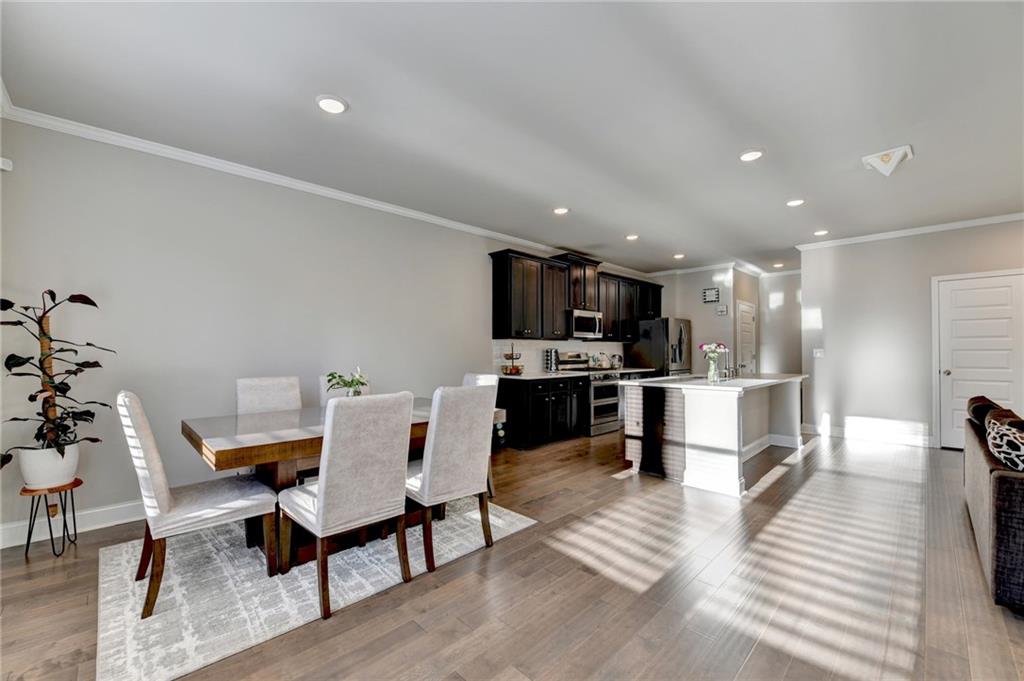 2230 Manor Pointe Drive Cumming, GA 30041 - Photo 9 of 53 a living room with furniture and kitchen view