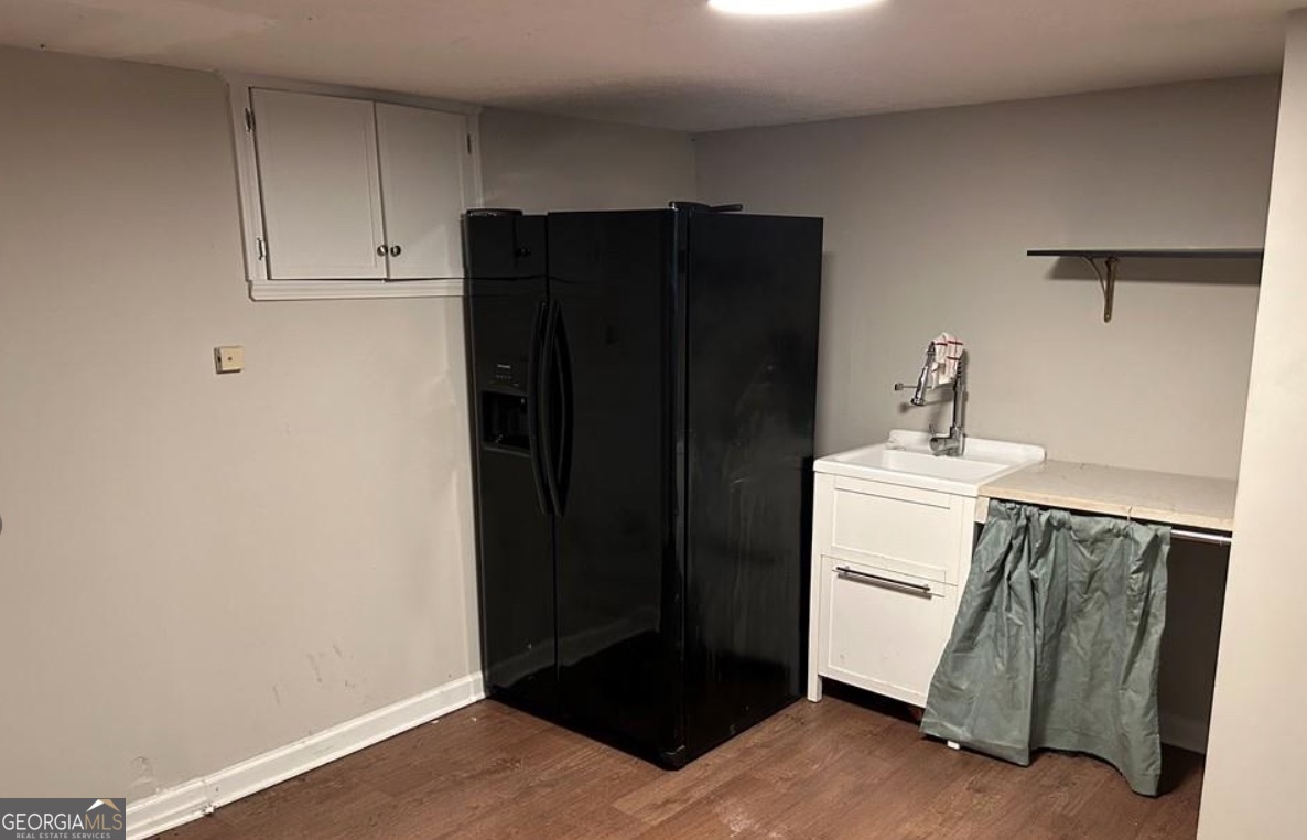 1734 East Broad Street Athens, GA 30601 - Photo 11 of 15 a bathroom with a sink and a mirror