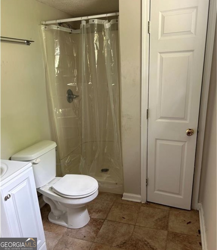 1734 East Broad Street Athens, GA 30601 - Photo 12 of 15 a bathroom with a toilet and a shower