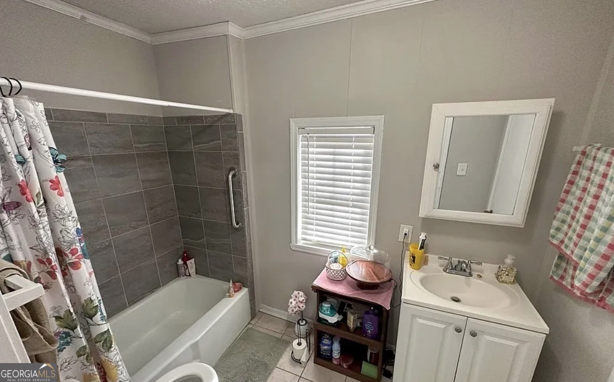 1734 East Broad Street Athens, GA 30601 - Photo 8 of 15 a bathroom with a sink toilet and shower