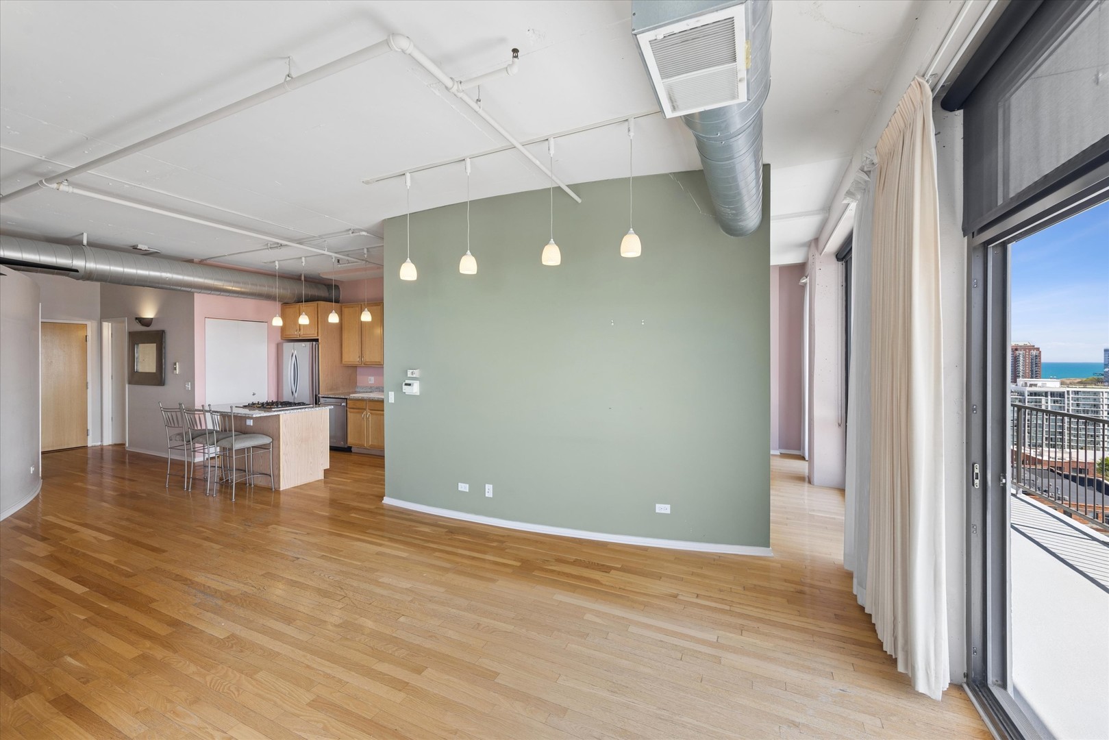 1530 South State Street, Unit 17R Chicago, IL 60605 - Photo 19 of 44 a view of empty room with wooden floor