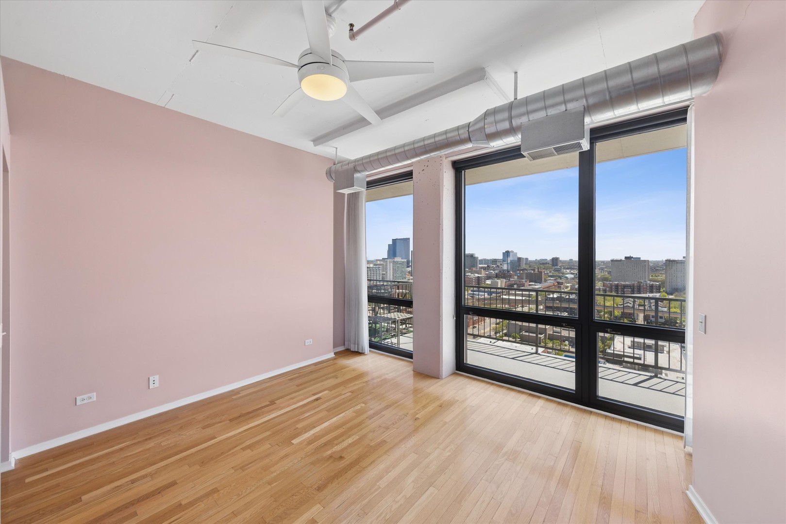 1530 South State Street, Unit 17R Chicago, IL 60605 - Photo 24 of 44 wooden floor in an empty room with a window