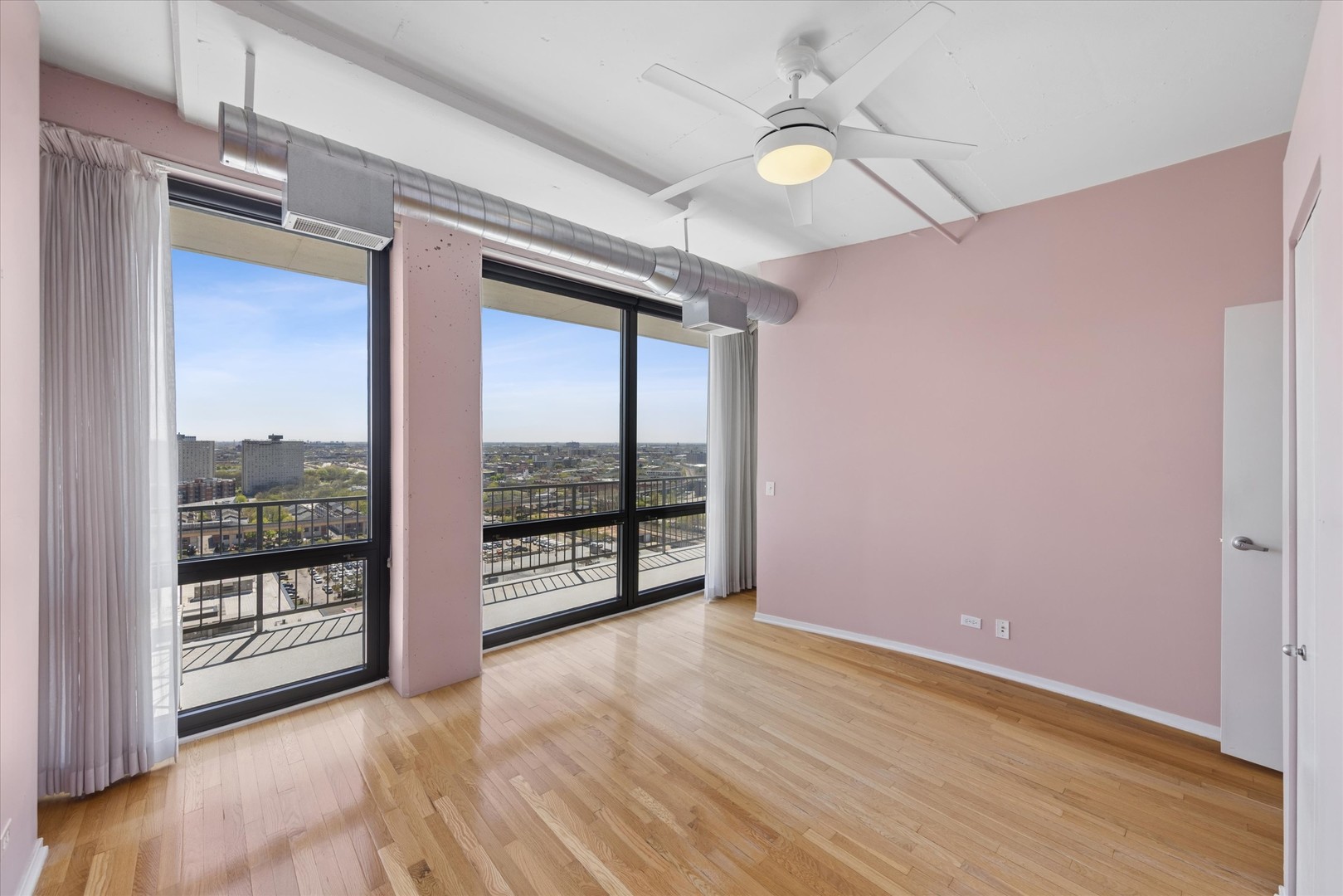 1530 South State Street, Unit 17R Chicago, IL 60605 - Photo 25 of 44 wooden floor in an empty room with a window