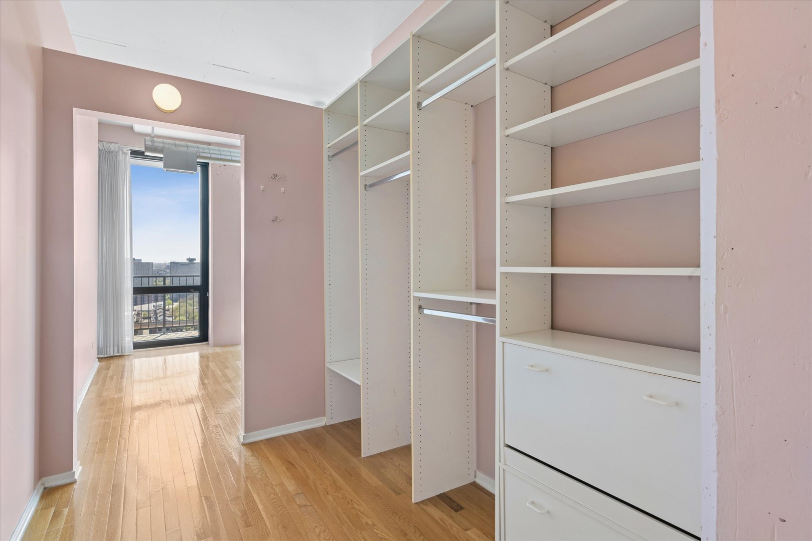 1530 South State Street, Unit 17R Chicago, IL 60605 - Photo 27 of 44 a view of walk in closet with empty racks